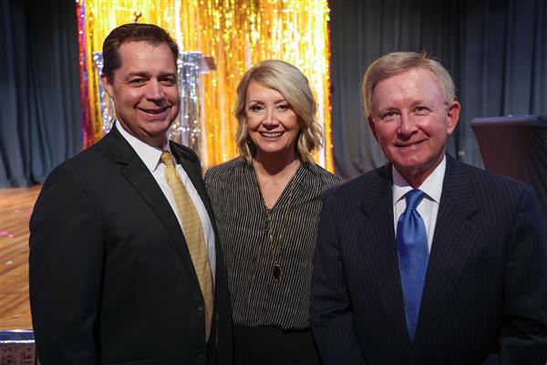 Dennis Gilliam, Ed.D., Debbie Gilliam, and Mike Royer smile into the camera.